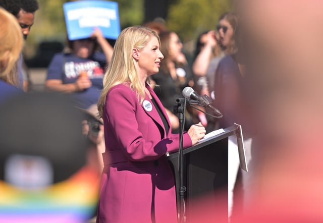 United States Representative Brittany Pettersen talks about her pregnancy during a Harris-Walz Fighting for Reproductive Freedom National Bus Tour stop outside Raíces Brewing Company in Denver on Oct. 7, 2024. (Photo by RJ Sangosti/The Denver Post)