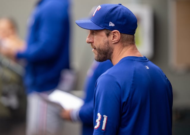 SEATTLE, WA - SEPTEMBER 15: Max Scherzer #31 of the Texas Rangers looks on from the dugout before a game against the Seattle Mariners at T-Mobile Park on September 15, 2024 in Seattle, Washington. Players are wearing #21 in honor of Roberto Clemente Day.