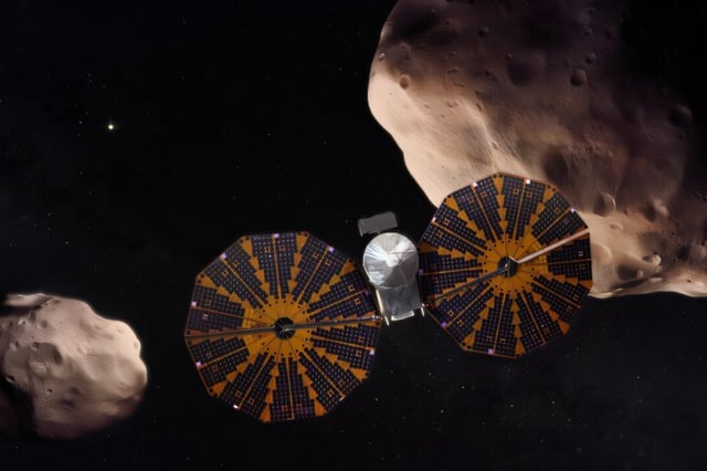 An artist's concept of the the Lucy spacecraft flying past the Trojan asteroids Patroclus and Menoetius. Illustration: NASA’s Goddard Space Flight Center/Conceptual Image Lab/Adriana Gutierrez