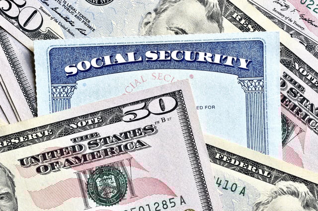 Stock photo of Social Security card and money