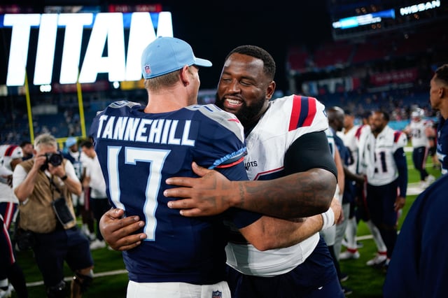 Aug 25, 2023; Nashville, Tennessee, USA; Tennessee Titans quarterback Ryan Tannehill (17) hugs New England Patriots defensive tackle Davon Godchaux (92) after the game at Nissan Stadium. Mandatory Credit: Andrew Nelles-USA TODAY Sports/File Photo