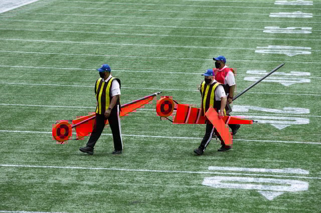 ATLANTA, GA - SEPTEMBER 27: Members of the chain gang walk off the field during the first half of an NFL football game between the Atlanta Falcons and the Chicago Bears at Mercedes-Benz Stadium on September 27, 2020 in Atlanta, Georgia.