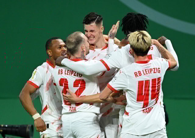 Soccer Football - DFB Cup - Quarter Final - RB Leipzig v VfL Wolfsburg - Red Bull Arena, Leipzig, Germany - February 26, 2025 RB Leipzig's Benjamin Sesko celebrates scoring their first goal with teammates REUTERS/Annegret Hilse