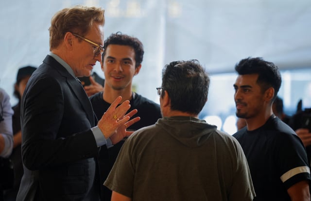 Academy Awards host Conan O'Brien speaks with the staff who will participate in the rollout of the red carpet for the 97th Academy Awards in Los Angeles, California, U.S., February 26, 2025. REUTERS/Mike Blake