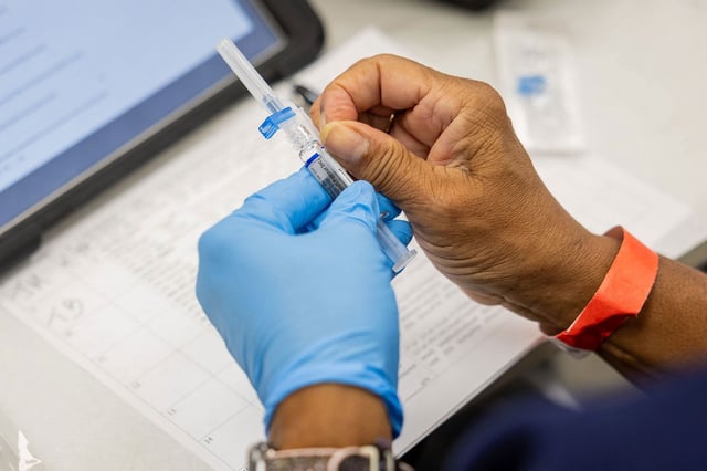 A nurse prepares to administer a flu shot during a 9th Ward COVID-19 and flu vaccination clinic at the Pullman Community Center in Chicago on Oct. 10, 2024. (Tess Crowley/Chicago Tribune/Tribune News Service via Getty Images)