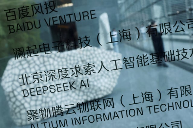 A DeepSeek AI sign is seen at a building where the Chinese start-up's office is located in Beijing, China, February 19, 2025. REUTERS/Florence Lo/File Photo
