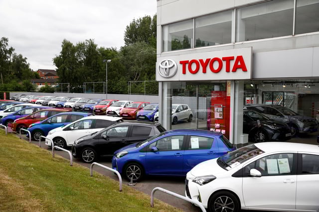 Cars are seen outside the Toyota car showroom in Stockport, Britain, May 26, 2020. REUTERS/Jason Cairnduff/File Photo