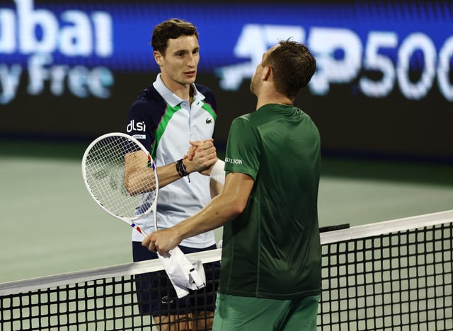 Tennis - Dubai Championships - Dubai Tennis Stadium, Dubai, United Arab Emirates - February 26, 2025 Netherlands' Tallon Griekspoor and France's Ugo Humbert shake hands after their round of 16 match REUTERS/Amr Alfiky
