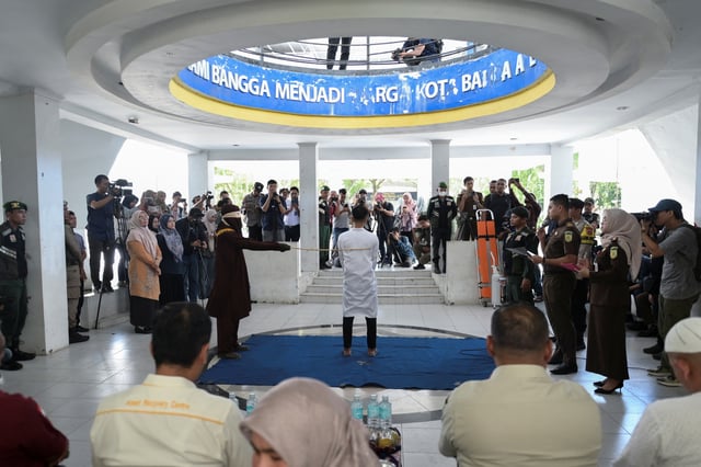 A man convicted of having same sex relationship is publicly caned by a Sharia Law official in Banda Aceh, Indonesia, February 27, 2025. REUTERS/Riska Munawarah