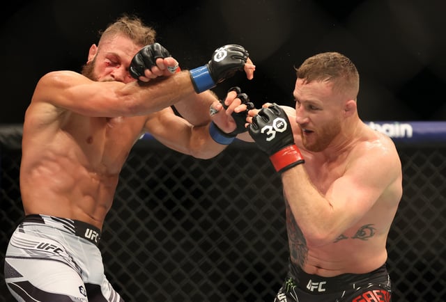 Justin Gaethje punches Rafael Fiziev during the Lightweight Bout between Justin Gaethje and Rafael Fiziev at The O2 Arena on March 18, 2023 in London, England.