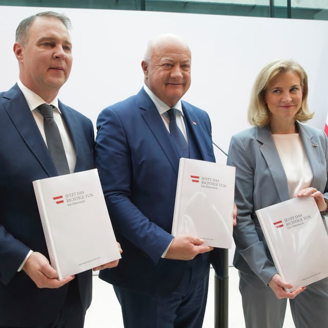 Austrian party leaders Christian Stocker of the Peoples' Party (OeVP), center, Andreas Babler of the Social Democrats (SPOe), left, and Beate Meinl-Reisinger of NEOS, right, pose with their government program after a news conference on forming a coalition government in Vienna, Austria, Thursday, Feb 27, 2025. (AP Photo/Heinz-Peter Bader)