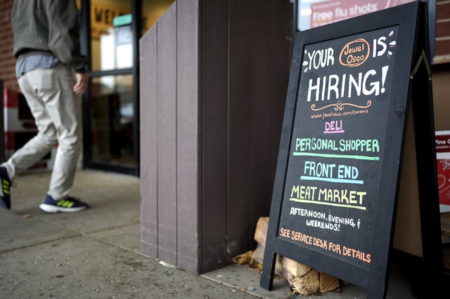 FILE- Hiring sign is displayed at a grocery store in Glenview, Ill., Monday, Nov. 25, 2024. (AP Photo/Nam Y. Huh, File)
