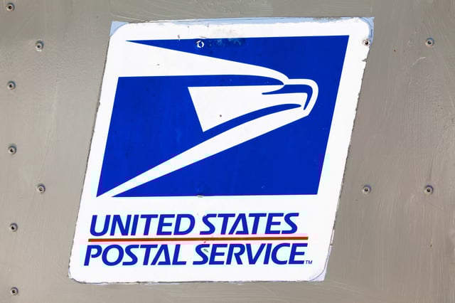 Close up of sign of United States Postal Service in Key West, Florida, taken on March 20, 2011.