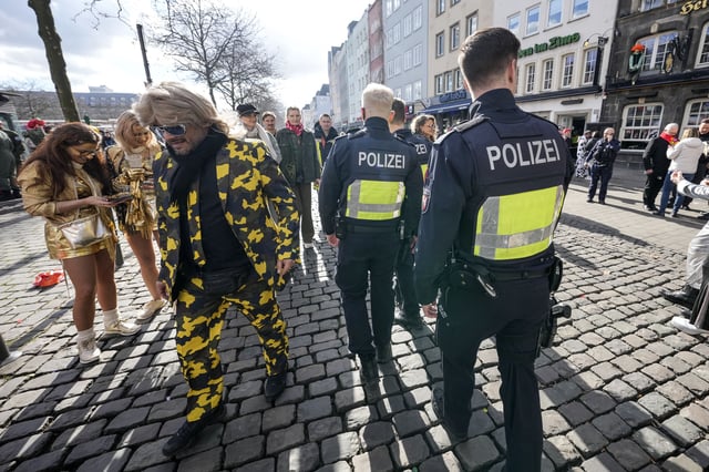 Police secures the start of the street carnival in Cologne, Germany, Thursday, Feb. 27, 2025. (AP Photo/Martin Meissner)