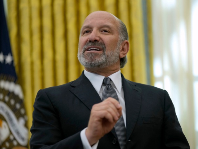 Commerce Secretary nominee Howard Lutnick speaks in the Oval Office of the White House after President Donald Trump signed an executive order, Thursday, Feb. 13, 2025, in Washington. (AP Photo/Ben Curtis)
