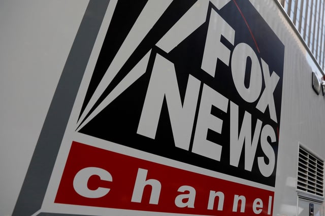 A Fox News channel sign is seen on a television vehicle outside the News Corporation building in New York City, in New York, U.S. November 8, 2017. REUTERS/Shannon Stapleton/File Photo