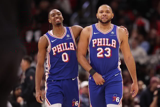 CHICAGO, ILLINOIS - JANUARY 25: Tyrese Maxey #0 and Eric Gordon #23 of the Philadelphia 76ers laugh against the Chicago Bulls during the second half at the United Center on January 25, 2025 in Chicago, Illinois.