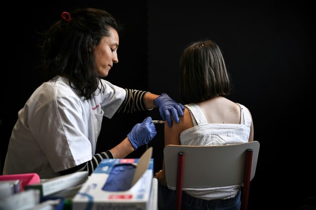 A schoolgirl receives a vaccine injection during a vaccination campaign against the papillomavirus (HPV infection) at the Jean Moulin Middle School in Le Bouscat, southwestern France