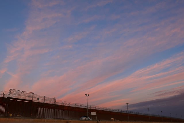 A general view shows the border wall between the United States and Mexico during sunset, as seen from Ciudad Juarez, Mexico, February 26, 2025. REUTERS/Jose Luis Gonzalez