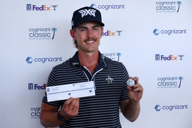 Jake Knapp of the United States poses with his scorecard and his ball after shooting a 59 during the first round of the Cognizant Classic in The Palm Beaches 2025 at PGA National Resort And Spa on February 27, 2025 in Palm Beach Gardens, Florida.