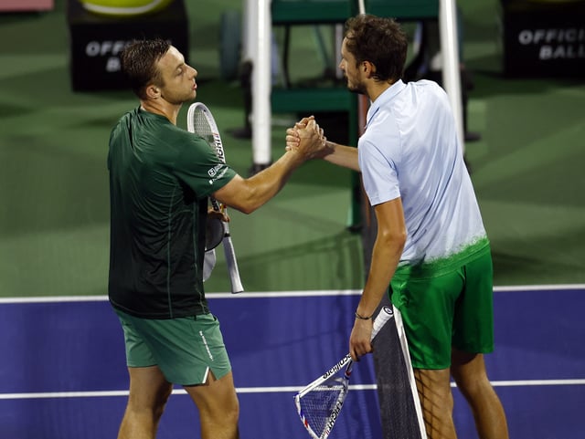 Tennis - Dubai Championships - Dubai Tennis Stadium, Dubai, United Arab Emirates - February 27, 2025 Netherlands' Tallon Griekspoor shakes hands with Russia's Daniil Medvedev after winning his quarter final match REUTERS/Rula Rouhana