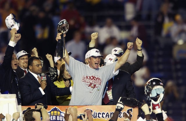 SAN DIEGO - JANUARY 26:  Head coach Jon Gruden of the Tampa Bay Buccaneers holds aloft the Lombardi Trophy as he celebrates after the victory over the Oakland Raiders in Super Bowl XXXVII on January 26, 2003 at Qualcomm Stadium in San Diego, California.  The Buccaneers won 48-21.  (Photo by Ezra Shaw/Getty Images)