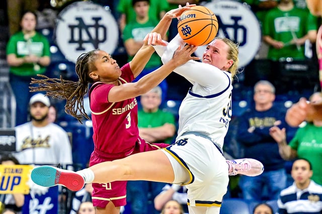 Feb 27, 2025; South Bend, Indiana, USA; Florida State Seminoles guard O'Mariah Gordon (3) and Notre Dame Fighting Irish forward Liza Karlen (32) attempt to get control of the ball in the second half at the Purcell Pavilion. Mandatory Credit: Matt Cashore-Imagn Images