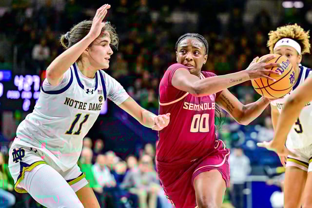 Feb 27, 2025; South Bend, Indiana, USA; Florida State Seminoles guard Ta'Niya Latson (00) drives to the basket as Notre Dame Fighting Irish guard Sonia Citron (11) defends in the first half at the Purcell Pavilion. Mandatory Credit: Matt Cashore-Imagn Images