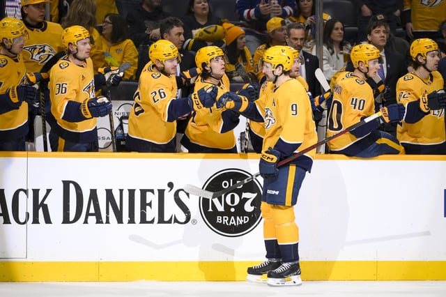 Feb 27, 2025; Nashville, Tennessee, USA;  \Nashville Predators left wing Filip Forsberg (9) celebrates his goal with his teammates against the Winnipeg Jets during the first period at Bridgestone Arena. Mandatory Credit: Steve Roberts-Imagn Images