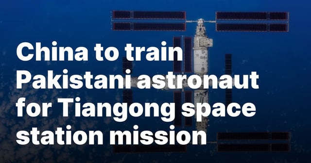 A top-down view of China's Tiangong space station, captured by the departing Shenzhou-16 spacecraft crew in late October 2023. The space station's three-module structure, large solar arrays, and docking ports are visible against the backdrop of Earth’s blue atmosphere and scattered clouds.