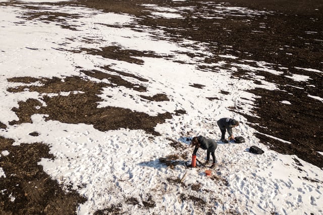 Environmental experts of CDM Engineering Ukraine,Yuliia Zazerina and Alina Tatarchuk, test the groundwater level at the Polokhivske lithium deposit that will be developed by Ukrlithium Mining in the Malovyskivsky district of Ukraine’s Kirovograd region, amid Russia's attack on Ukraine, February 27, 2025.  REUTERS/Thomas Peter/File Photo