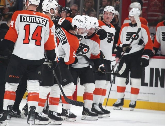Feb 27, 2025; Pittsburgh, Pennsylvania, USA;  Philadelphia Flyers right wing Garnet Hathaway (19)  is assisted off of the ice after suffering an apparent injury after being hit by Pittsburgh Penguins left wing Bokondji Imama (not pictured) during the second period at PPG Paints Arena. Mandatory Credit: Charles LeClaire-Imagn Images