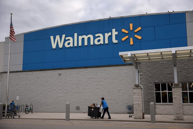 A Walmart sign is displayed outside a Supercenter on November 18, 2024 in Miami, Florida.
