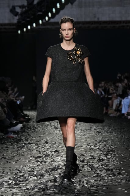 A model wears a creation as part of the Moschino Fall/Winter 2025-2026 Womenswear collection presented in Milan, Italy, Friday, Feb. 28, 2025. (AP Photo/Luca Bruno)