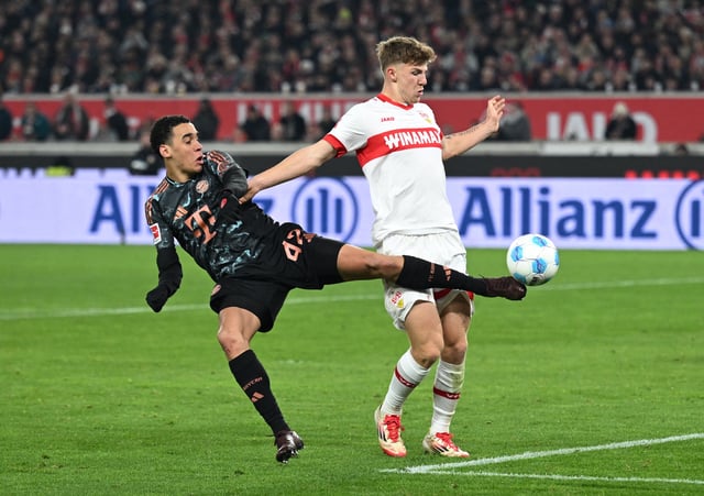 Soccer Football - Bundesliga - VfB Stuttgart v Bayern Munich - MHPArena, Stuttgart, Germany - February 28, 2025 Bayern Munich's Jamal Musiala in action with VfB Stuttgart's Angelo Stiller REUTERS/Angelika Warmuth