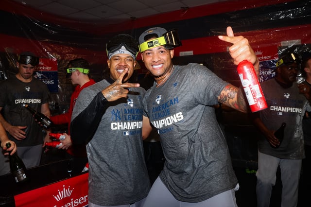 CLEVELAND, OHIO - OCTOBER 19: Marcus Stroman #0 and Luis Gil #81 of the New York Yankees celebrate after winning Game Five of the American League Championship Series against the Cleveland Guardians at Progressive Field on October 19, 2024 in Cleveland, Ohio.
