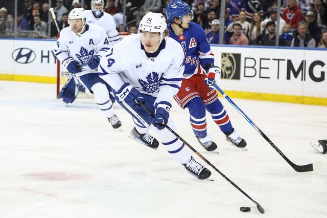 Feb 28, 2025; New York, New York, USA;  Toronto Maple Leafs center Bobby McMann (74) controls the puck in the third period against the New York Rangers at Madison Square Garden. Mandatory Credit: Wendell Cruz-Imagn Images