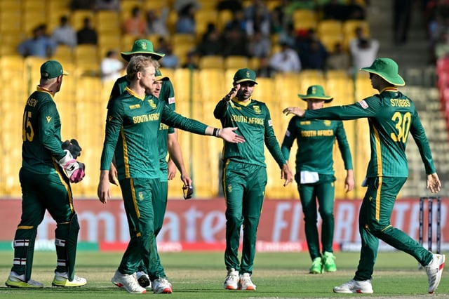 South Africa players celebrate in Karachi
