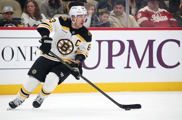 Mar 1, 2025; Pittsburgh, Pennsylvania, USA;  Boston Bruins left wing Brad Marchand (63) skates with the puck against the Pittsburgh Penguins during the first period at PPG Paints Arena. Charles LeClaire-Imagn Images