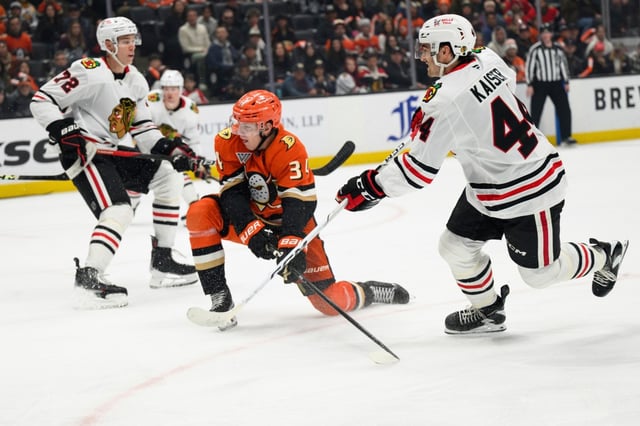 Chicago Blackhawks defenseman Wyatt Kaiser, right, shoots and scores during the second period of an NHL hockey game against the Ducks, Saturday, March 1, 2025, in Anaheim. (AP Photo/William Liang)