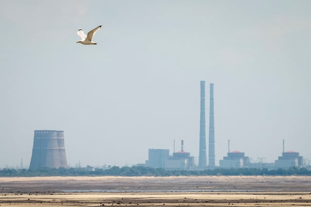 A view shows Zaporizhzhia Nuclear Power Plant from the bank of Kakhovka Reservoir near the town of Nikopol after the Nova Kakhovka dam breached, amid Russia's attack on Ukraine, in Dnipropetrovsk region, Ukraine June 16, 2023. REUTERS/Alina Smutko/File Photo