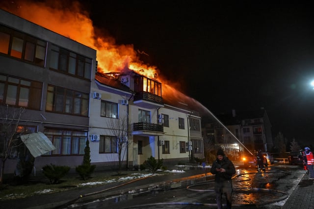 Firefighters work at a site of an apartment building hit by a Russian drone strike, amid Russia's attack on Ukraine, in Zaporizhzhia, Ukraine March 1, 2025. REUTERS/Stringer