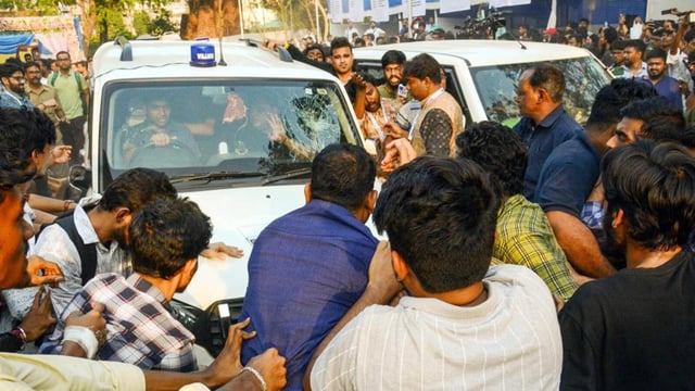 Members of CPI(M) students wing SFI surround the car of West Bengal education minister Bratya Basu during a protest demanding immediate student union elections, at Jadavpur University in Kolkata on Saturday. (ANI Photo)