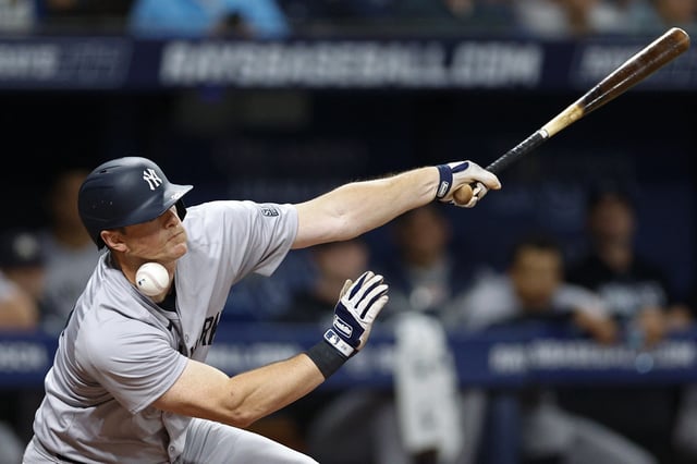 ST PETERSBURG, FLORIDA - JULY 10: DJ LeMahieu #26 of the New York Yankees is struck by his foul ball in the sixth inning against the Tampa Bay Rays at Tropicana Field on July 10, 2024 in St Petersburg, Florida.