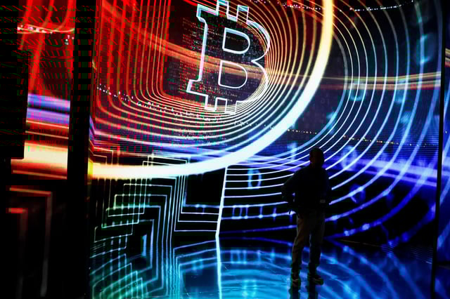 A Bitcoin enthusiast poses for pictures during the kick-off of the Plan B Forum El Salvador, in San Salvador, El Salvador, January 30, 2025. REUTERS/Jose Cabezas/File Photo