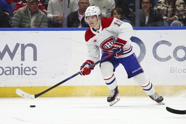 Montreal Canadiens right wing Cole Caufield looks to pass the puck during the second period of an NHL hockey game against the Buffalo Sabres, Saturday, March 1, 2025, in Buffalo, N.Y. (AP Photo/Jeffrey T. Barnes)