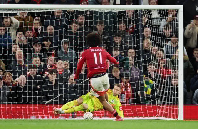 Soccer Football - FA Cup - Fifth Round - Manchester United v Fulham - Old Trafford, Manchester, Britain - March 2, 2025  Fulham's Bernd Leno saves from Manchester United's Joshua Zirkzee to win the penalty shoot-out REUTERS/Phil Noble