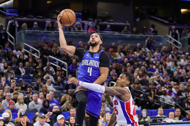 Jan 25, 2025; Orlando, Florida, USA; Orlando Magic guard Jalen Suggs (4) is fouled by Detroit Pistons guard Marcus Sasser (25) during the second half at Kia Center. Mike Watters-Imagn Images/File Photo