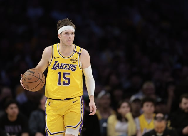 LOS ANGELES, CALIFORNIA - FEBRUARY 27: Austin Reaves #15 of the Los Angeles Lakers brings up the ball during a 111-102 Lakers win over the Minnesota Timberwolves at Crypto.com Arena on February 27, 2025 in Los Angeles, California.