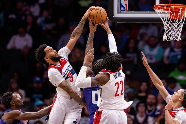 Mar 1, 2025; Charlotte, North Carolina, USA; Washington Wizards forward Justin Champagnie (9) and forward Richaun Holmes (22) block a shot from Charlotte Hornets forward Miles Bridges (0) during the third quarter at Spectrum Center. Scott Kinser-Imagn Images/File Photo